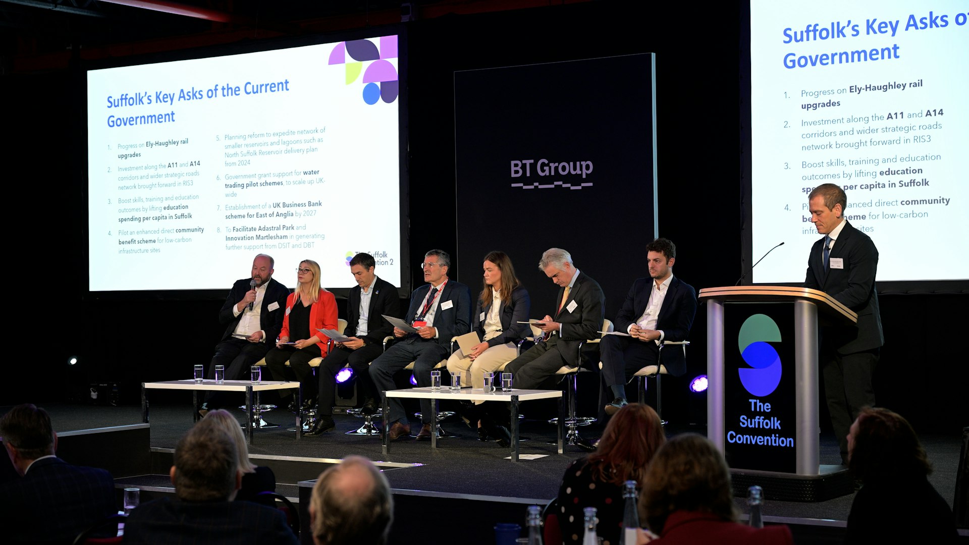 People sat on stage in a room